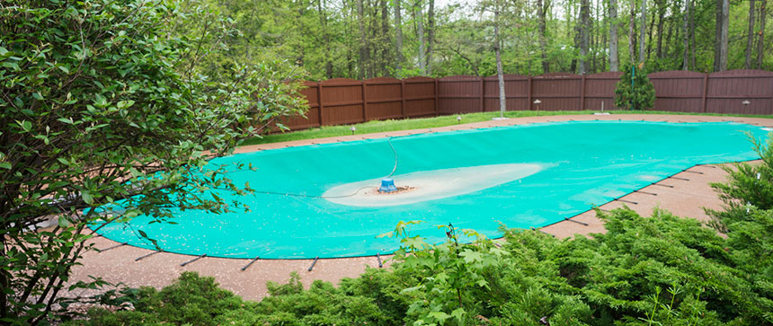 backyard pool with pool cover